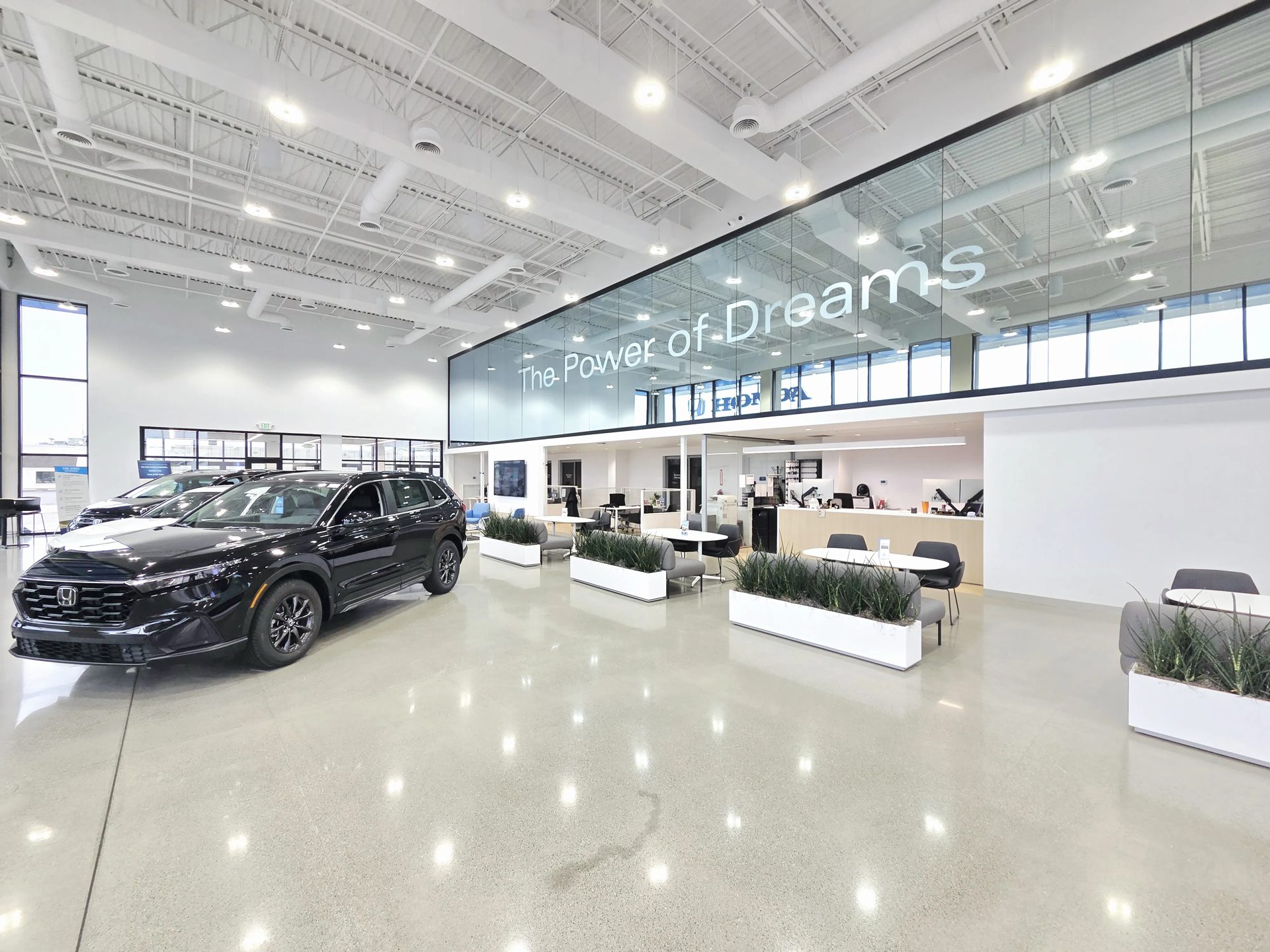 The Don Ayres Honda showroom floor with a new CR-V and customer lounge